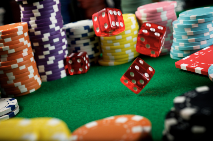 A close-up of poker chips and dice